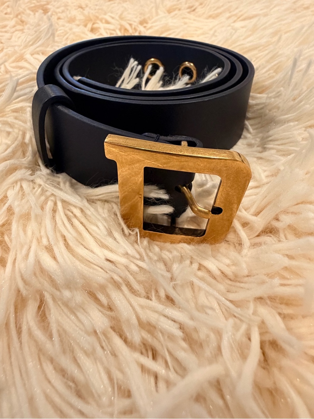 Christian Dior navy blue belt with a gold tone D buckle.